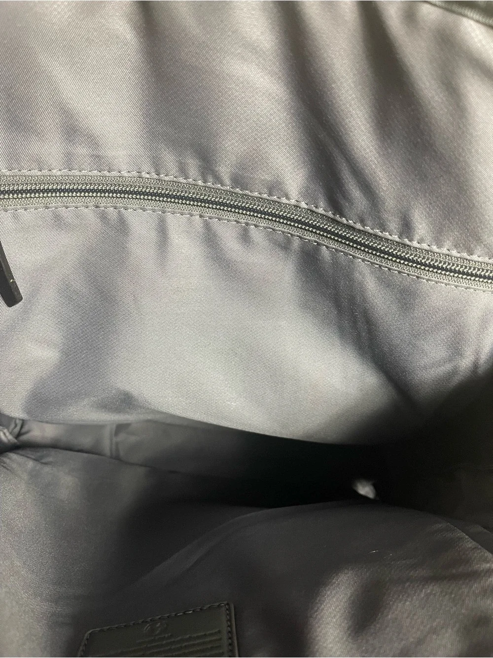 Tumi Voyageur Halsey nylon Gray Backpack with leather Top Handles.